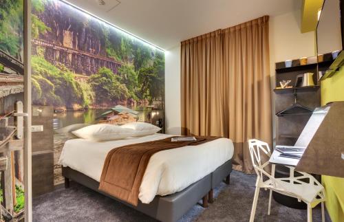 Säng eller sängar i ett rum på Hôtel Kyriad Rennes