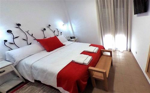 Postel nebo postele na pokoji v ubytování Hostal Aquaforum