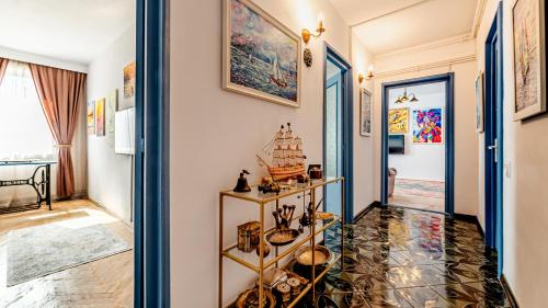 a corridor of a room with a hallway at Central Art Apartment with Treasure Hunt, Free Parking & Self Check-In in Constanţa
