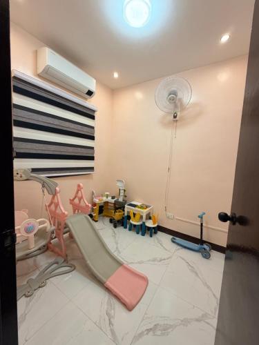 a room with a play room with toys in it at serene genar in General Trias