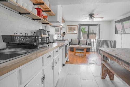 a kitchen with white cabinets and a counter top at 2BR Apt 8 min to Integris Monthly 15 Off #N3 in Oklahoma City