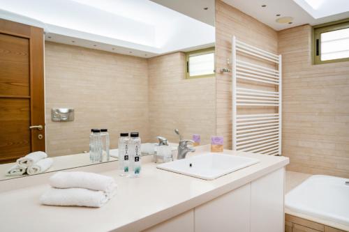 a bathroom with a sink and a mirror at Panorama Villa Sitia in Sitia