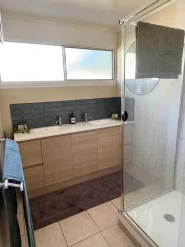 a bathroom with a shower and a sink at Cowan Lodge in Cowan Cowan