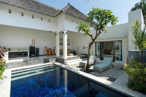 an image of a villa with a swimming pool at The Seminyak Suites Private Villas in Seminyak