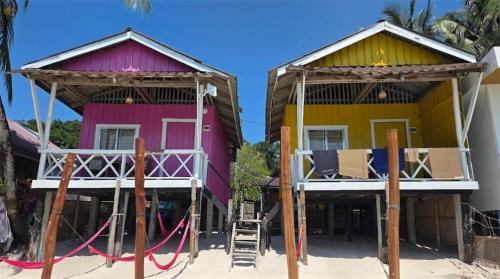 a group of houses on the beach at Paradiso Ocean front Bungalows in Koh Rong Island