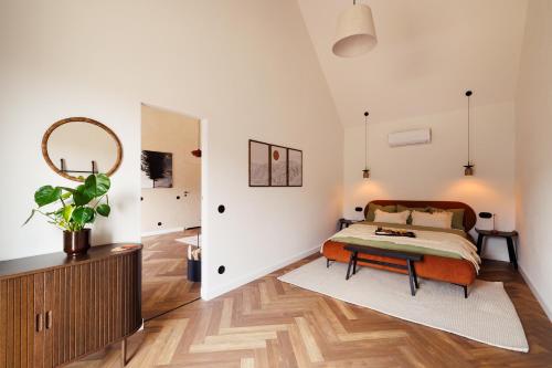 a bedroom with a bed and a table at Folga in Tarnawa Dolna
