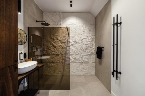 a bathroom with a shower and a sink at Folga in Tarnawa Dolna