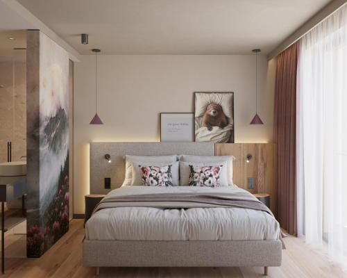 a bedroom with a large bed and a large window at Ziach & Candy Grossarl in Grossarl