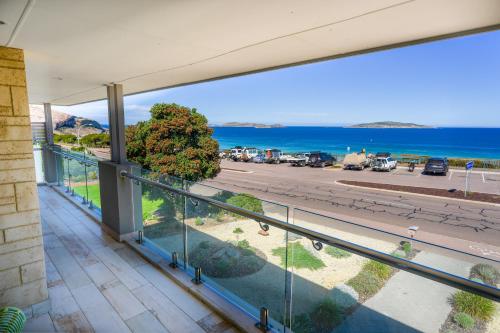 a balcony with a view of the ocean at West Beach House in Esperance