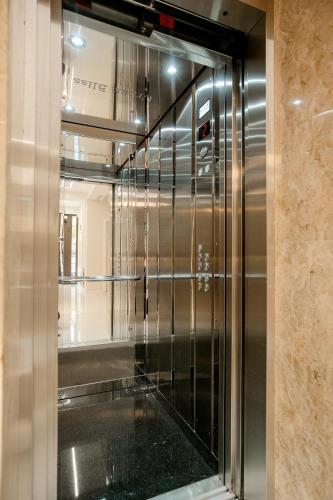 a elevator in a building with a glass door at Hotel Urban Bliss in Tbilisi City