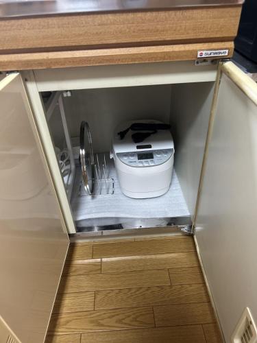 a kitchen drawer with a slow cooker in it at AOMORI LOVERS Minatomachi Base in Aomori