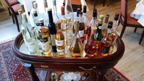 a group of bottles of wine on a table at Hotel Haus am See in Simmerath