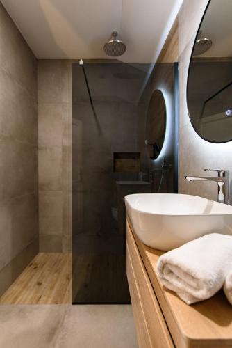 a bathroom with a sink and a mirror at Bottega in Mlini