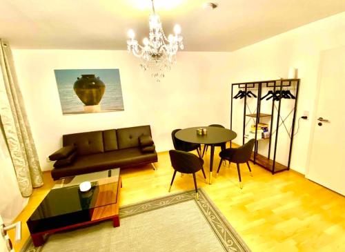 a living room with a couch and a table at Weimar Cityappartement in Weimar