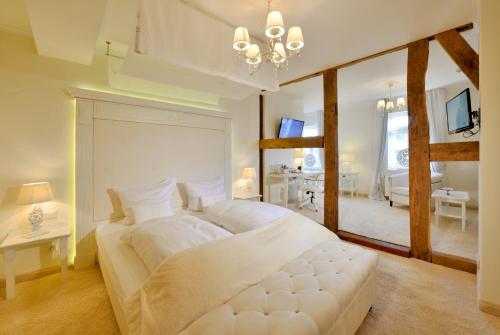 Ένα ή περισσότερα κρεβάτια σε δωμάτιο στο Hotel Alte Schule