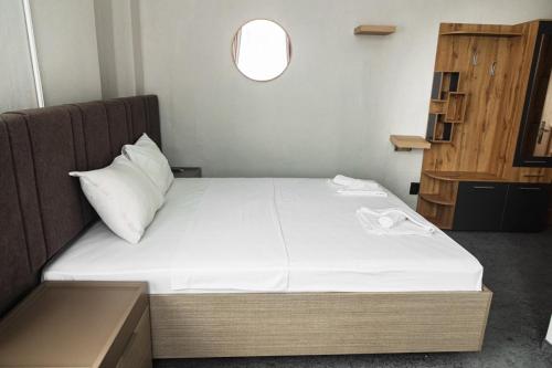 a bed in a small room with a window at Family Boutique in Veliko Tŭrnovo