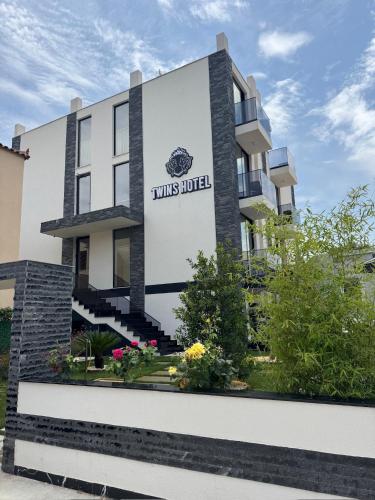 a building with a sign that reads this hotel at Twins Hotel Vlore in Vlorë