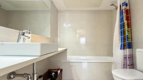 a bathroom with a sink and a toilet and a shower at Esglesia 7 2-4 in L'Estartit