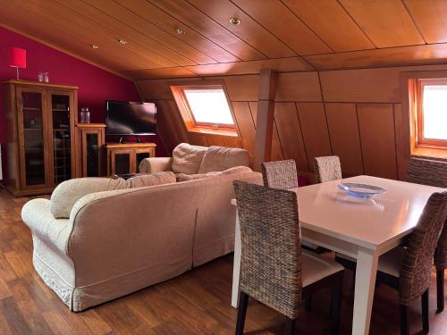 a living room with a couch and a table at Dúplex centro de Ribeira con WIFI by Cristian&Tamara"alquileres" in Ribeira