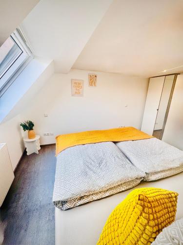 a bedroom with two beds in a attic at Family & Work Apartment in Schopfloch