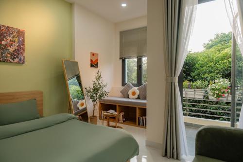 a bedroom with a bed and a window at Sai Gon Stay-Hi-Tech Park Collection in Ho Chi Minh City