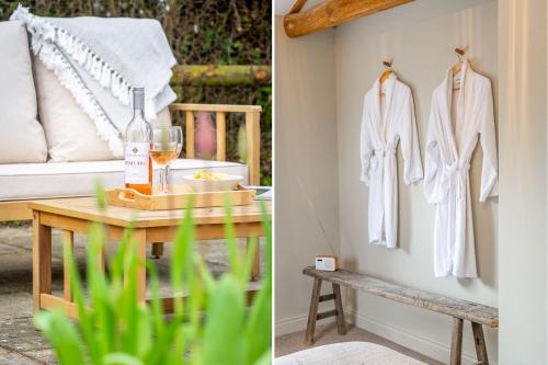 a room with a table with a wine glass and a robe at The Cottage at Tuffon Hall in Sible Hedingham