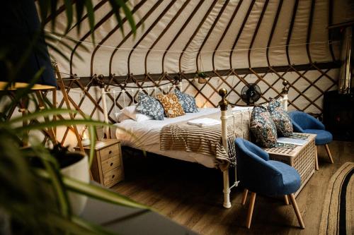 a bedroom with a bed in a yurt at Kelburn Yurts - Bourtrees in Fairlie
