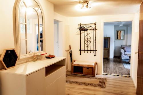 a bathroom with a mirror and a sink at Ferienwohnung Otto in Pegnitz