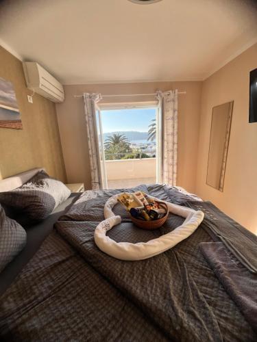 a room with a bed with a bowl of food on it at Villa Birk in Barbat na Rabu