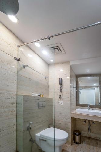 a bathroom with a toilet and a sink at Rosetum Anjuna Goa in Anjuna