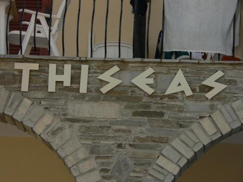 a sign on a brick wall with the word hate at Hotel Argo in Siviri