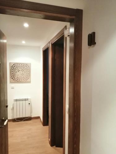 an open door into a room with a radiator at Apartamentos Casa Memé in Mora de Rubielos