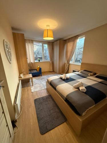a bedroom with a large bed in a room at The Cozy House in Kyustendil