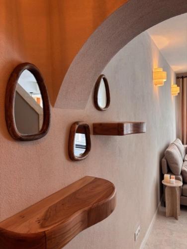 a bathroom with two mirrors on a wall at CASA LEONE - fully renovated since April 2026 - new pictures in Carvoeiro