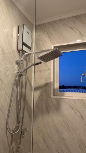 a shower with a laptop screen in a bathroom at Modern Studio with Stylish Interior in Dorp Sint Michiel