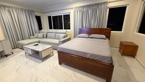 a bedroom with a bed and a living room at Modern Studio with Stylish Interior in Dorp Sint Michiel