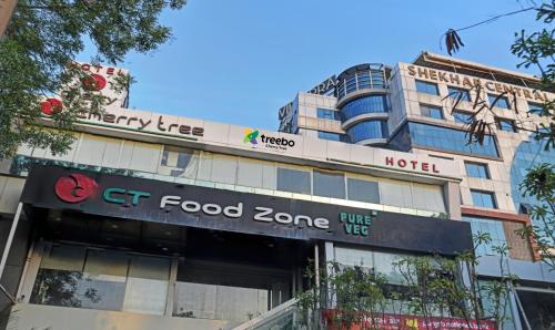 a building with a ct food zone sign on it at Treebo Cherry Tree in Indore