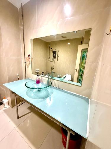 a bathroom with a sink and a mirror at Parkview Suites Near By Klcc in Kuala Lumpur