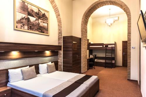 a bedroom with a bed and a bunk bed at SOUS44 in Budapest