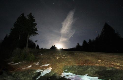 a cloud in the sky over a field at night at La Chanterelle - Mountain Lodge in La Côte dʼArbroz