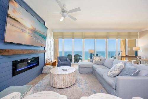 a living room with a couch and a tv at Phoenix Orange Beach II 2103 in Orange Beach