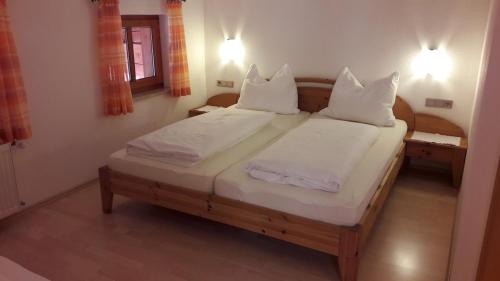 Un pat sau paturi într-o cameră la Riegergut