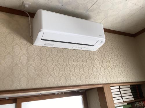 a printer on the ceiling of a room at 森のしずく in Azumino
