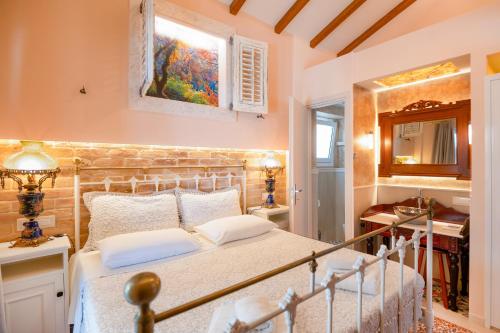 a bedroom with a white bed in a room at Villa Kadith Agios Gordios in Agios Gordios