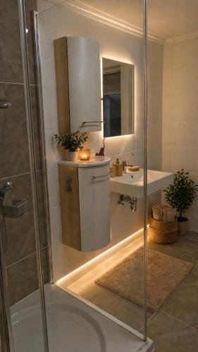 a bathroom with a shower and a sink at Ferienwohnung Eleni in Mauth