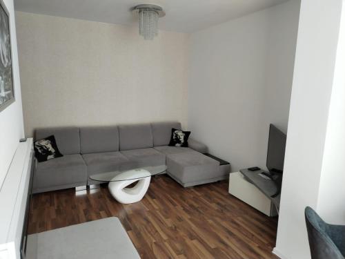 a living room with a couch and a table at Oliver apartmán 6 in Štrbské Pleso
