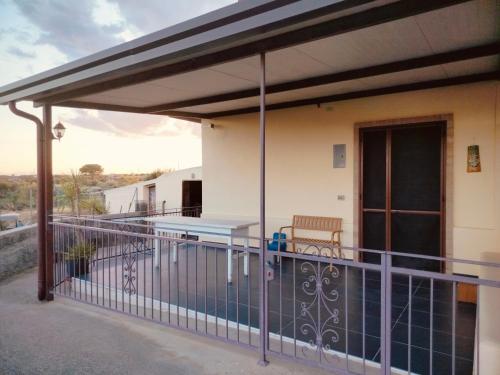 awning over a balcony with a pool at CASA NATURA - CAMPAGNA e MARE - in Marconia