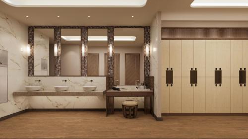 a large bathroom with two sinks and a large mirror at Sheraton Uşak Hotel & Thermal Spa in Uşak