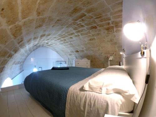 Postel nebo postele na pokoji v ubytování Idris Loft Matera