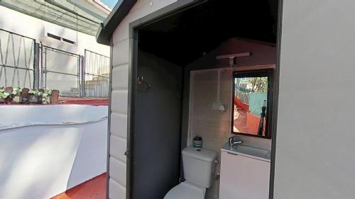 a bathroom with a toilet and a sink at Apartaments Kandy 2 in Calafell